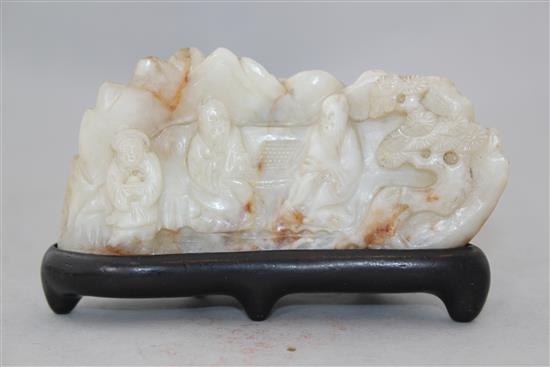 A Chinese white and russet bowenite jade mountain, 20th century, 11.5cm, wood stand